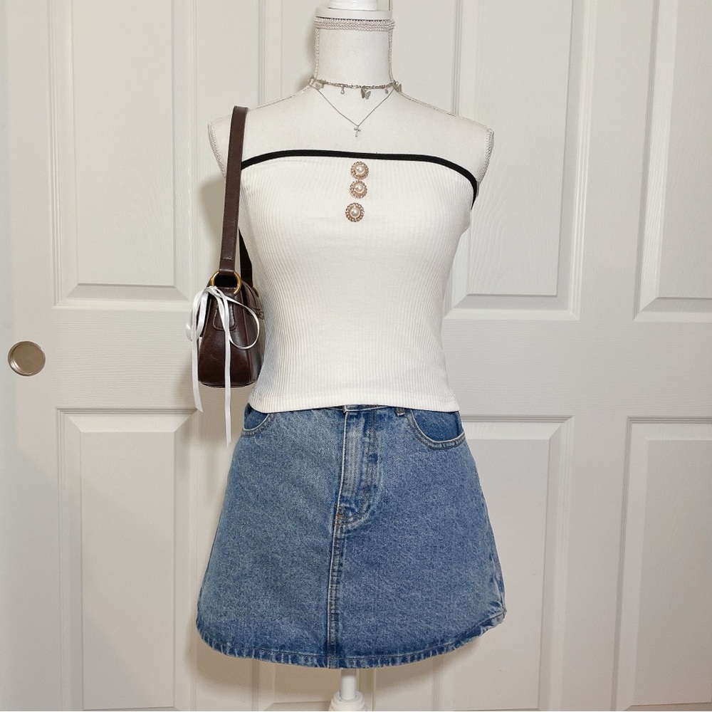 White ribbed crop top with black contrast and pearl buttons